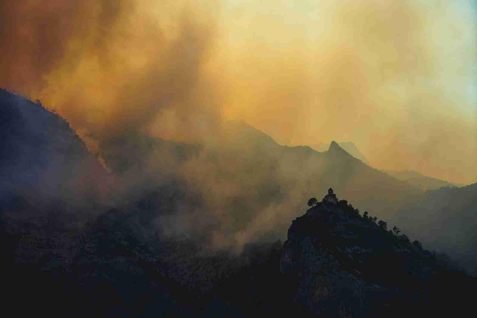 a mountain with clouds